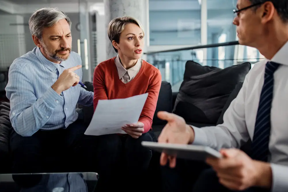 A lawyer mediating between family members, showing professional assistance.