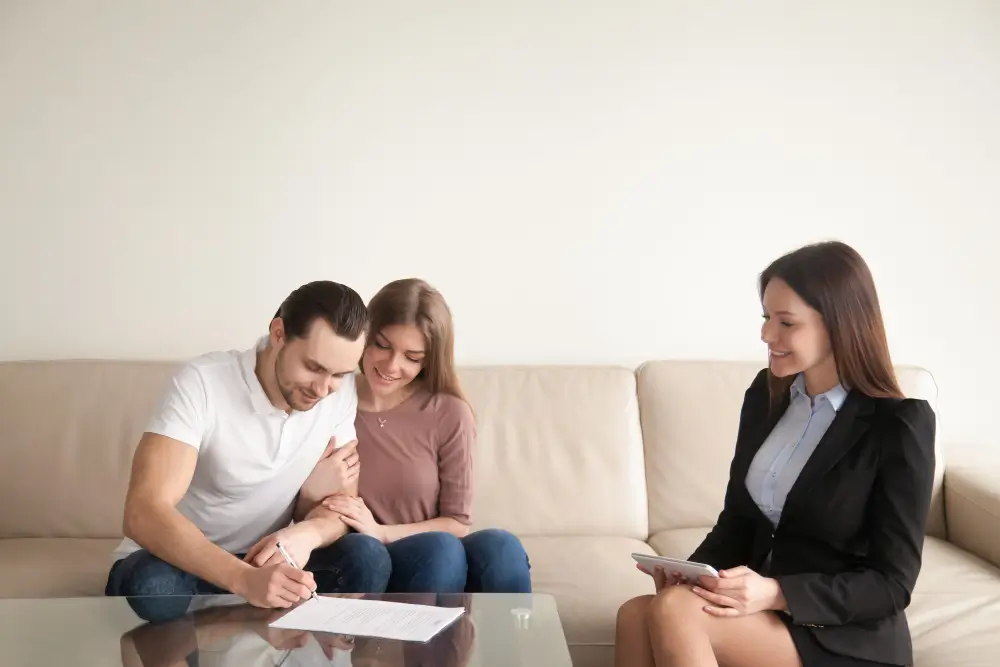 A lawyer comforting a family during a probate consultation.